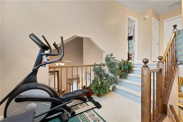 a view of a livingroom with furniture and a window
