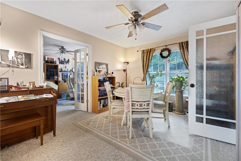 110 River Terrace Point Roswell, GA 30076 - Photo 9 of 24 a view of a livingroom with furniture and a window