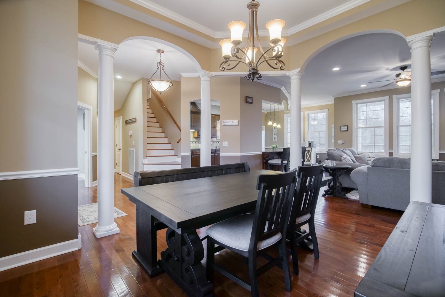 a view of a dining room with furniture and wooden floor