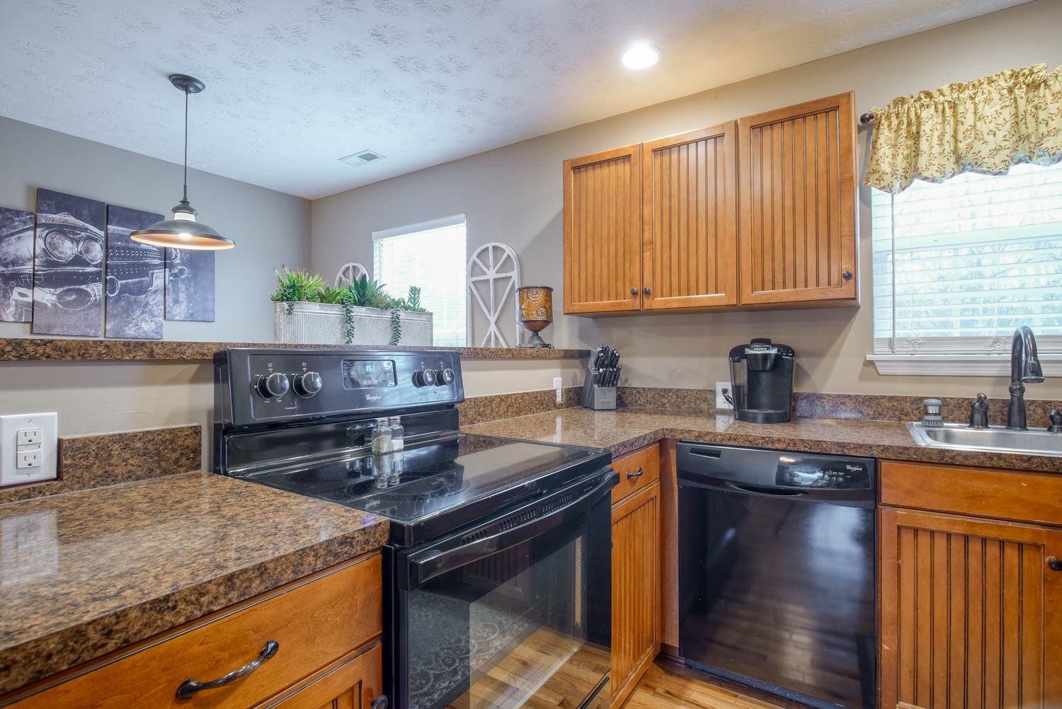 197 Turner Road Watertown, TN 37184 - Photo 35 of 65 a kitchen with kitchen island granite countertop wooden cabinets granite counter tops and a stove