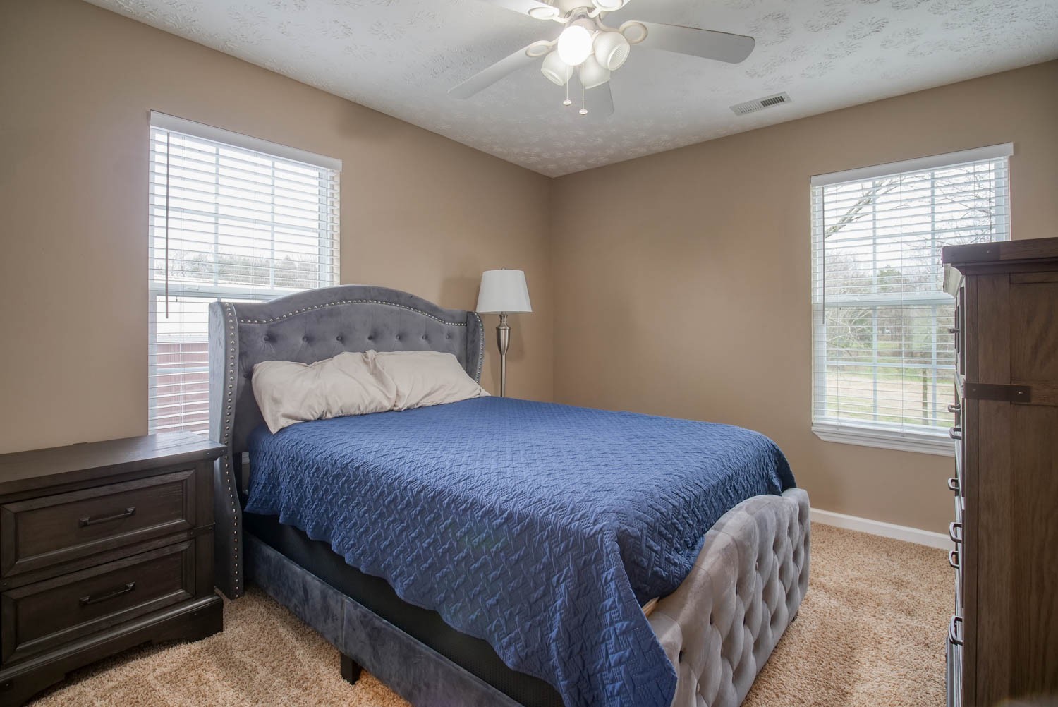 197 Turner Road Watertown, TN 37184 - Photo 41 of 65 a bedroom with a bed and a chandelier