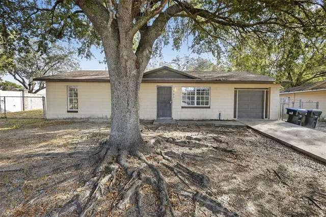 front view of house with a trees