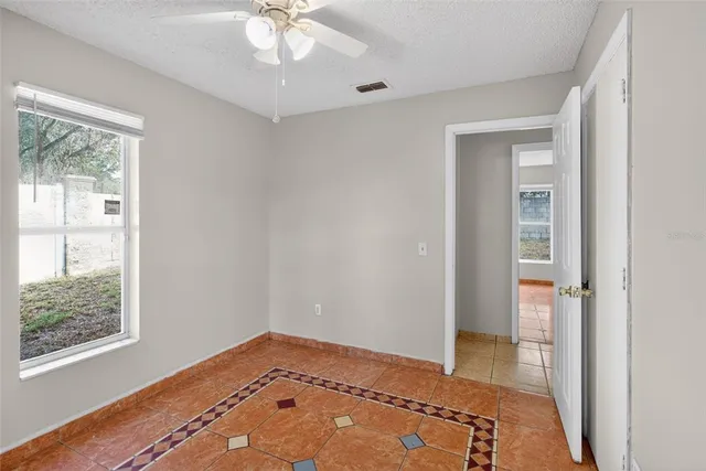 a view of an empty room and window