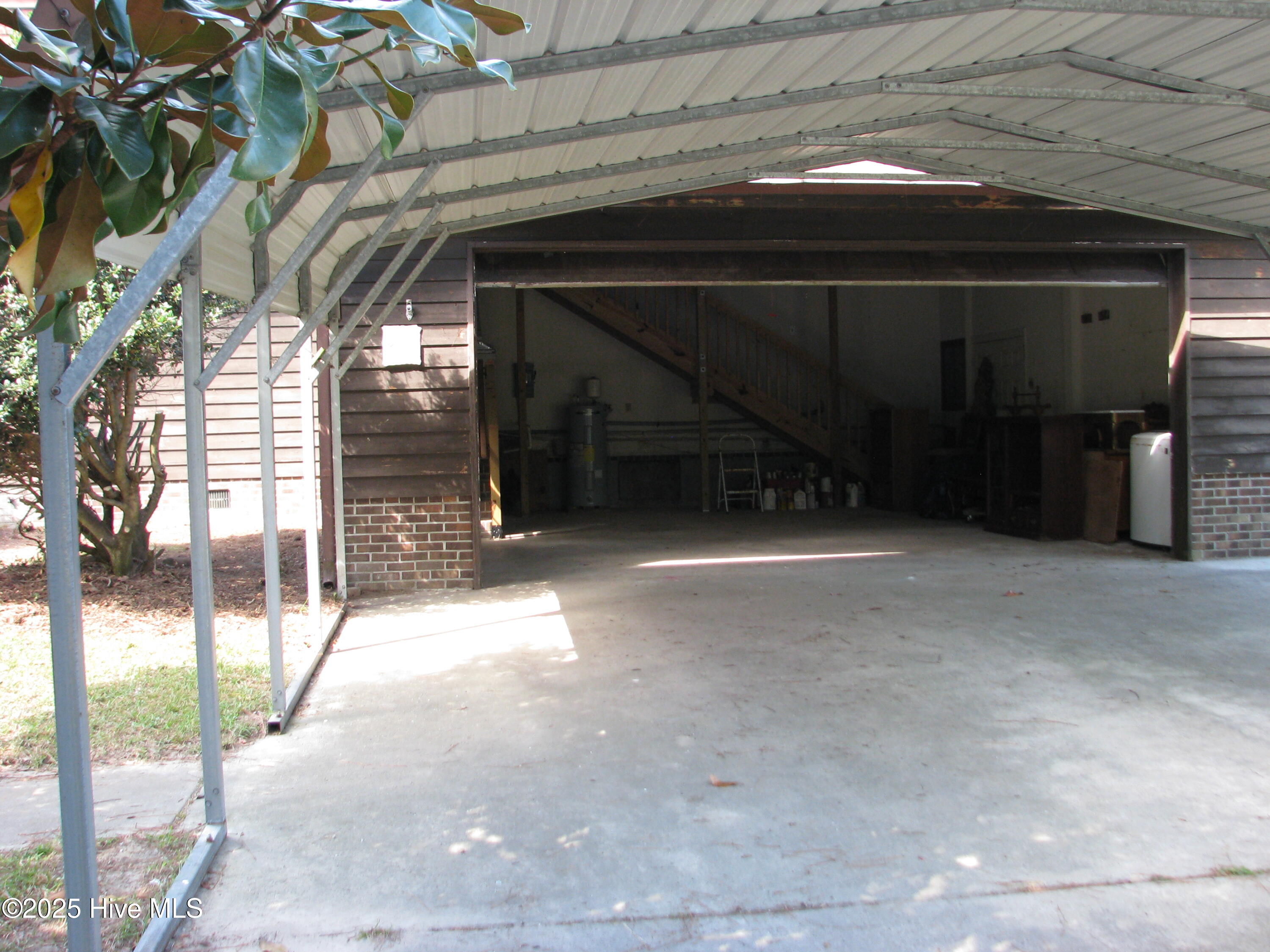 227 Rhodes Drive Columbia, NC 27925 - Photo 5 of 24 Double attached garage and metal carport