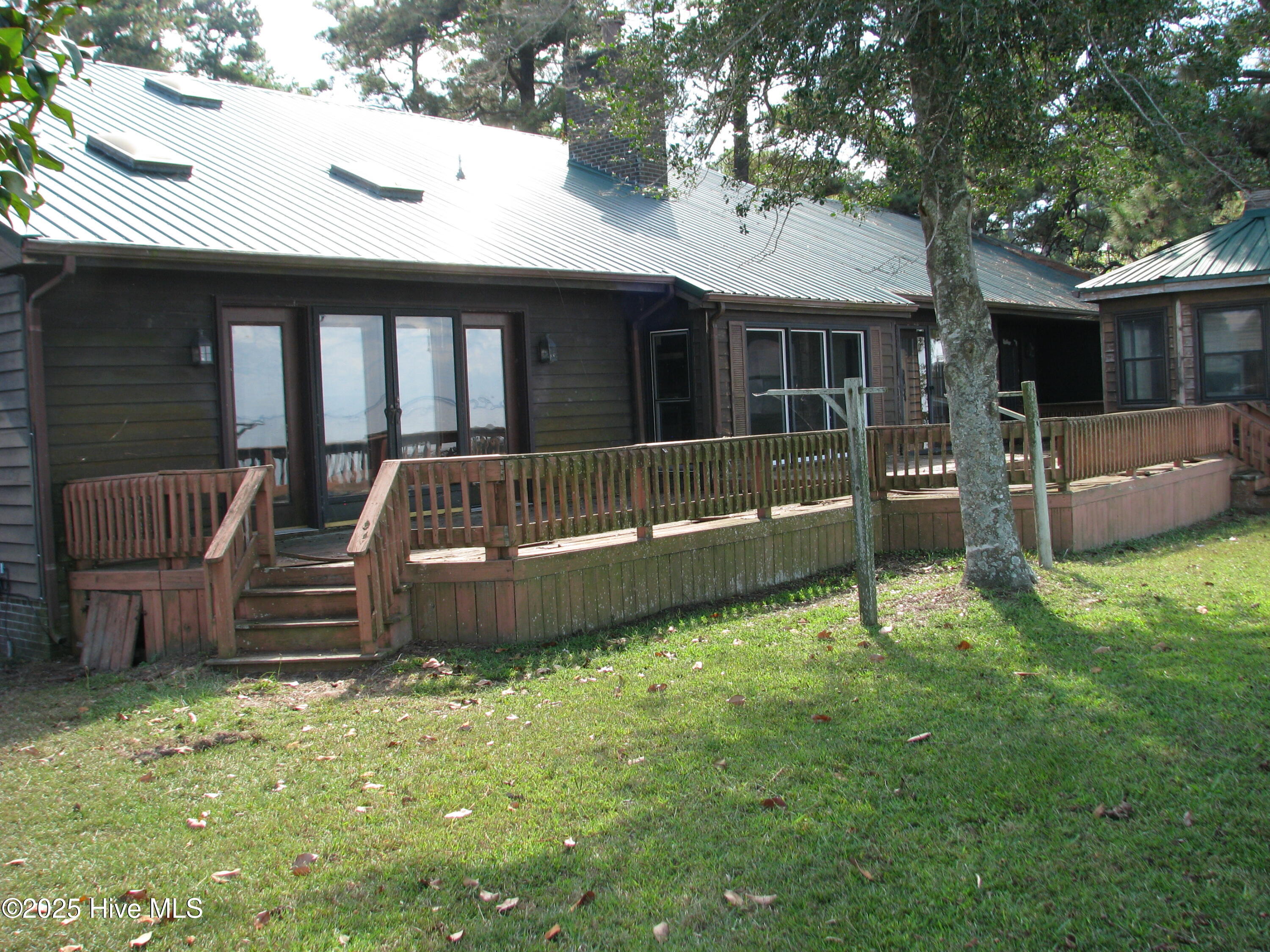 227 Rhodes Drive Columbia, NC 27925 - Photo 8 of 24 Back view, note decking