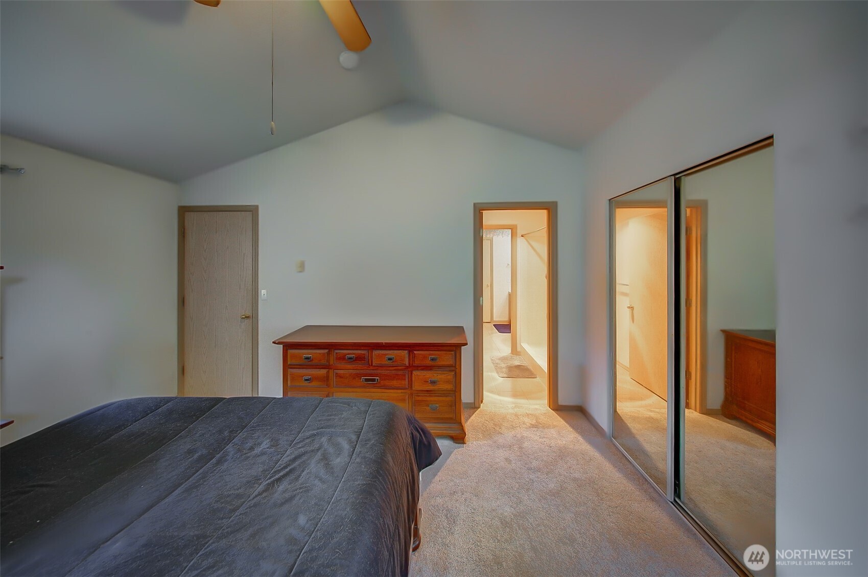 6001 Merlot Lane Southeast Lacey, WA 98513 - Photo 16 of 40 a bedroom with a bed and wooden floor