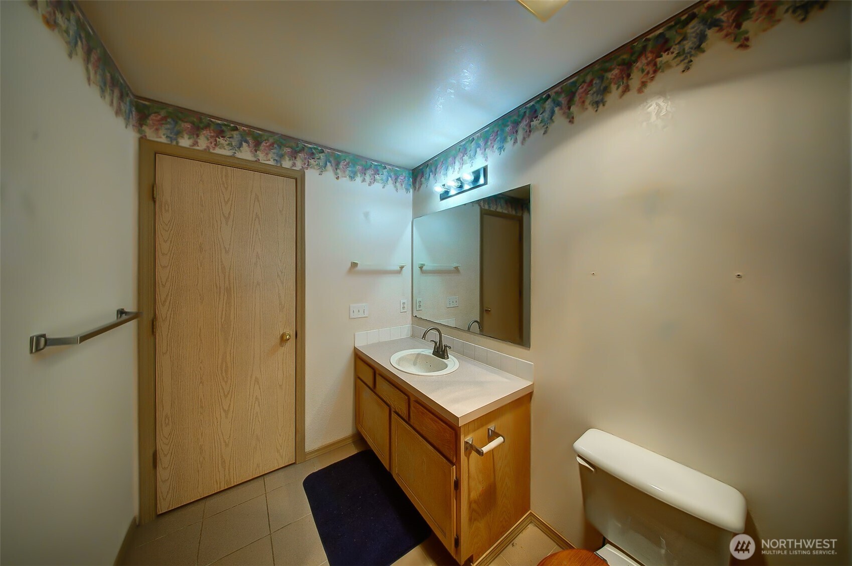 6001 Merlot Lane Southeast Lacey, WA 98513 - Photo 18 of 40 a bathroom with a sink a toilet and mirror