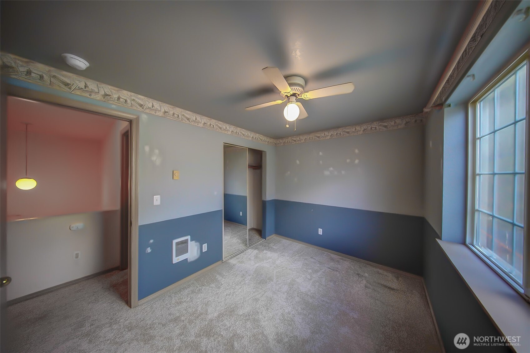 6001 Merlot Lane Southeast Lacey, WA 98513 - Photo 23 of 40 en empty room with windows and ceiling fan