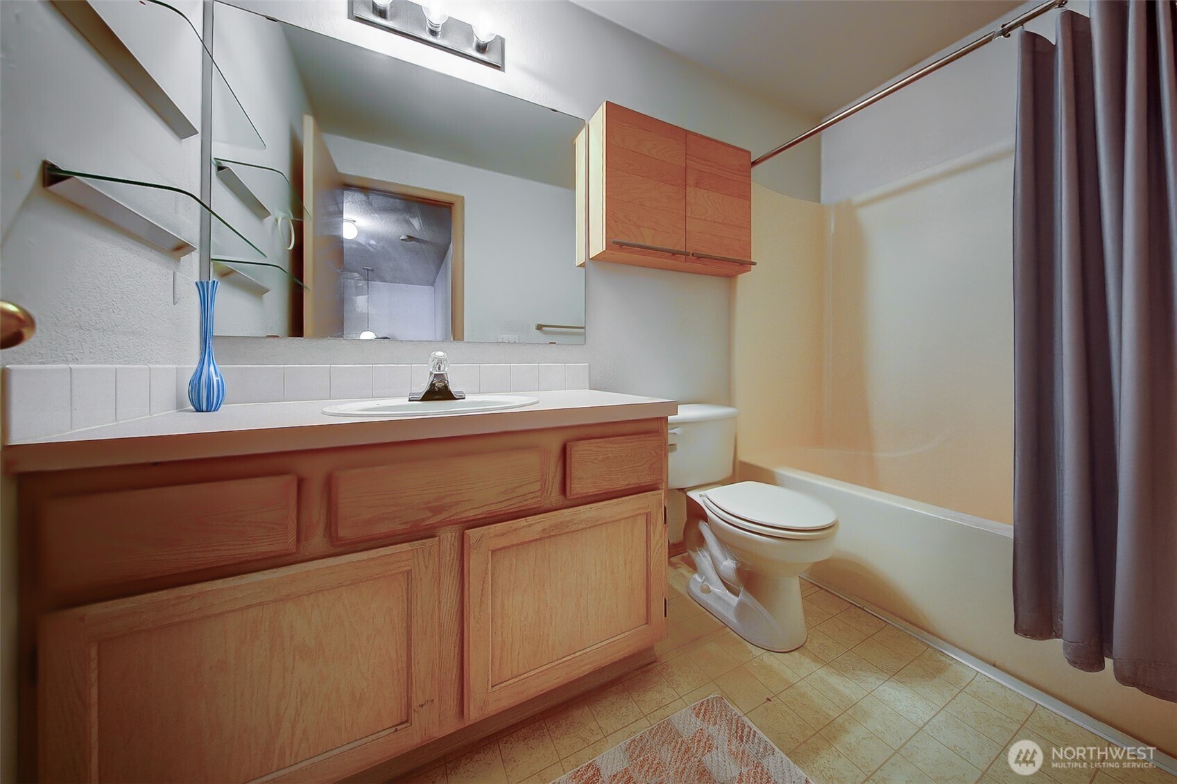 6001 Merlot Lane Southeast Lacey, WA 98513 - Photo 26 of 40 a bathroom with a toilet sink and mirror