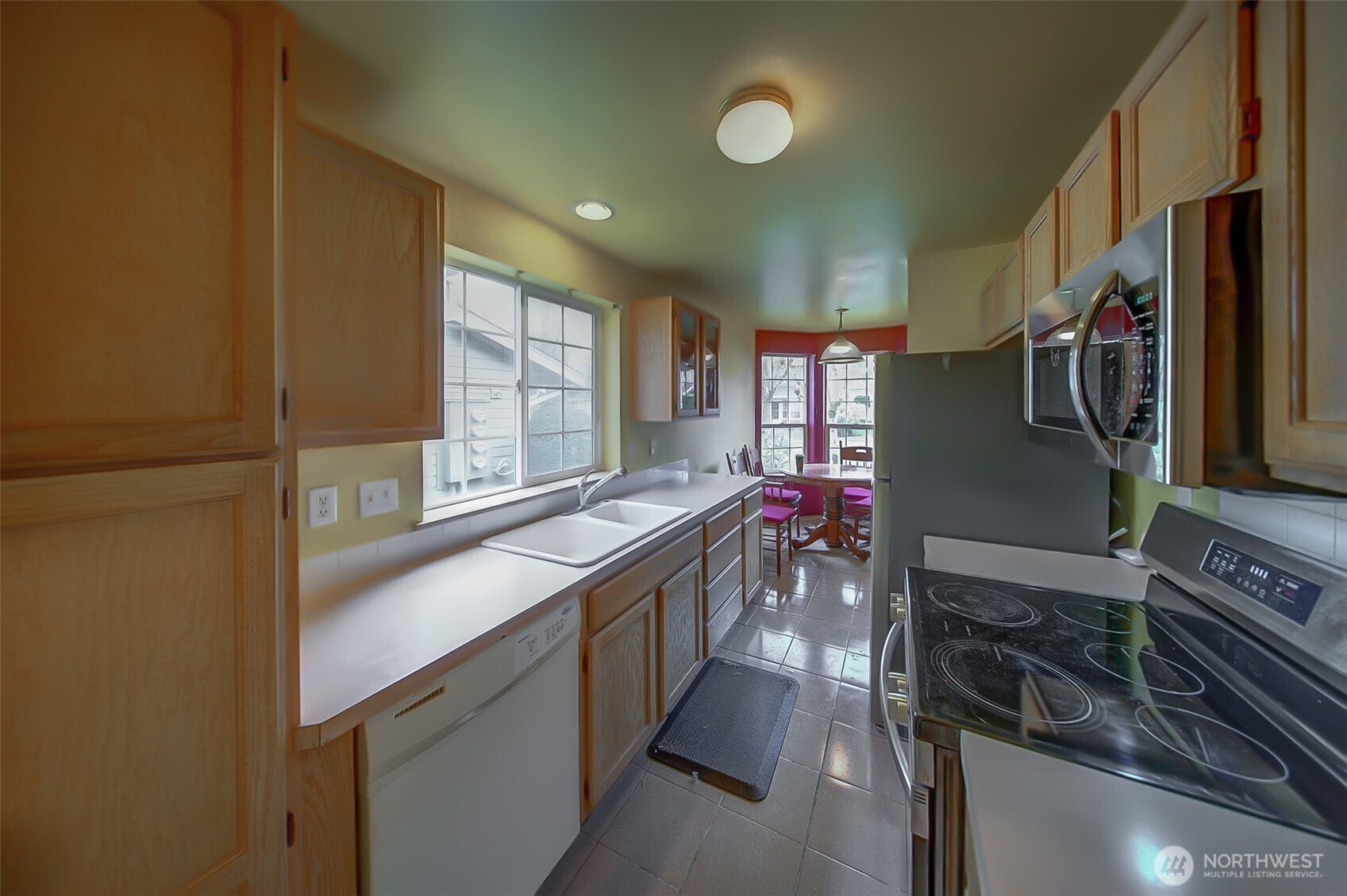 6001 Merlot Lane Southeast Lacey, WA 98513 - Photo 8 of 40 a kitchen with stainless steel appliances a sink stove and cabinets
