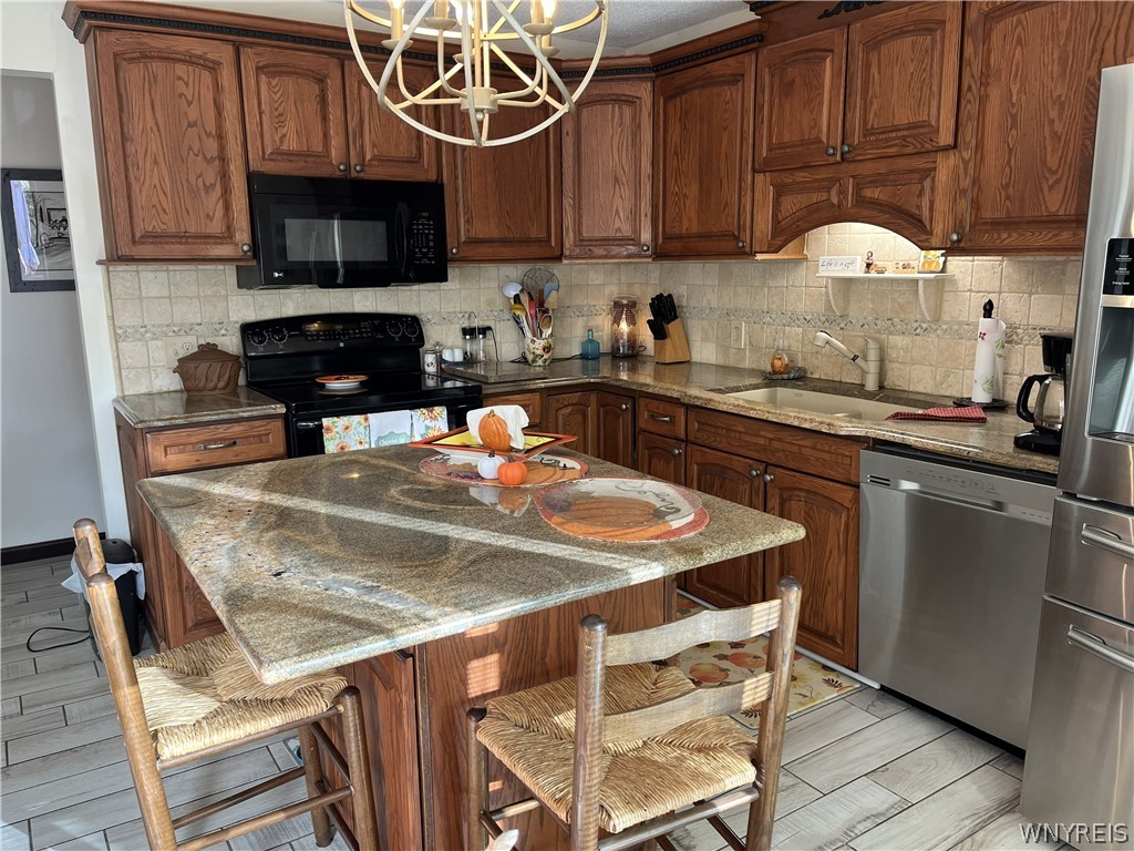 1999 Dugan Road Olean, NY 14760 - Photo 20 of 30 Rich wood cabinets and granite countertops highlig