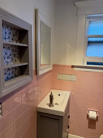 a bathroom with a sink toilet and vanity