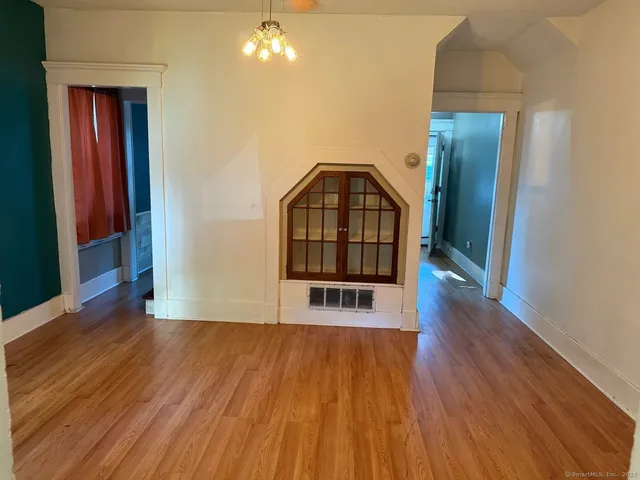 a view of a livingroom with wooden floor