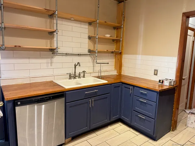 a kitchen with a sink and cabinets