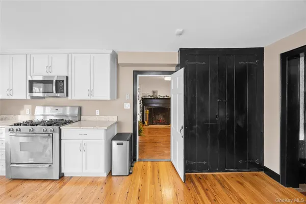 a kitchen with granite countertop wooden cabinets and a sink