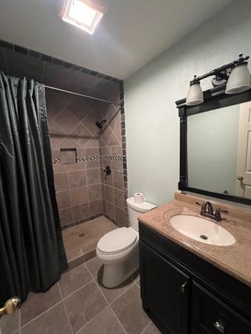 445 West Railroad Street China, TX 77613 - Photo 12 of 25 a bathroom with a sink a toilet a mirror and shower