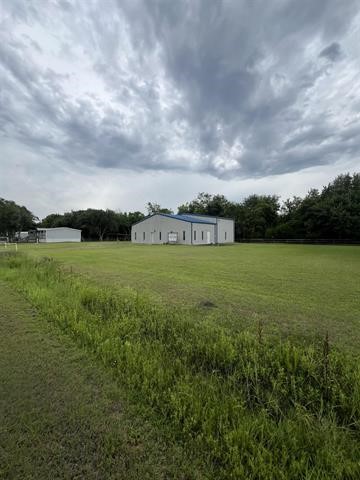 445 West Railroad Street China, TX 77613 - Photo 5 of 25 a view of a lake with houses in the back