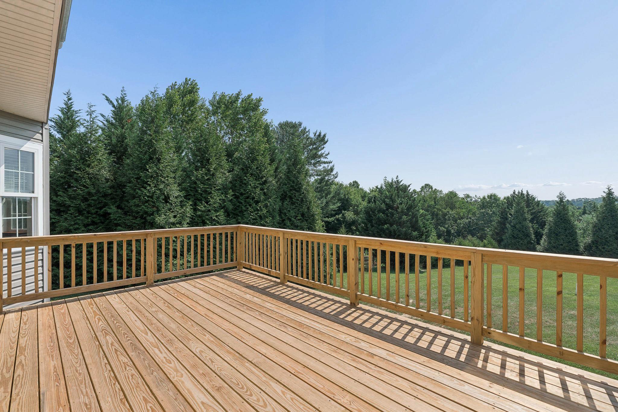 4521 Beckleysville Road Hampstead, MD 21074 - Photo 26 of 54 The newly constructed deck overlooks the backyard.