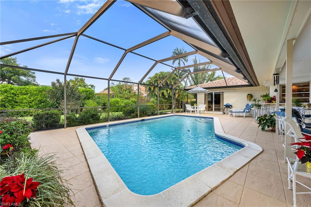 737 Anchor Rode Drive Naples, FL 34103 - Photo 20 of 21 Outdoor pool featuring a patio, a sunroom, and a lanai