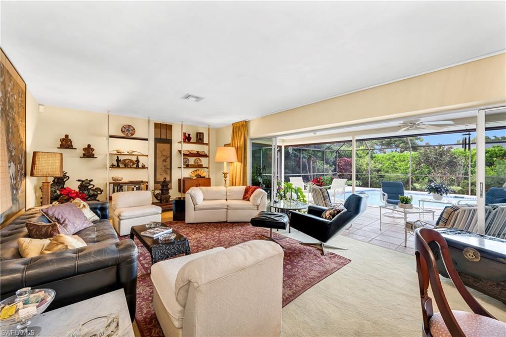 737 Anchor Rode Drive Naples, FL 34103 - Photo 6 of 21 Living area with a ceiling fan and a sunroom