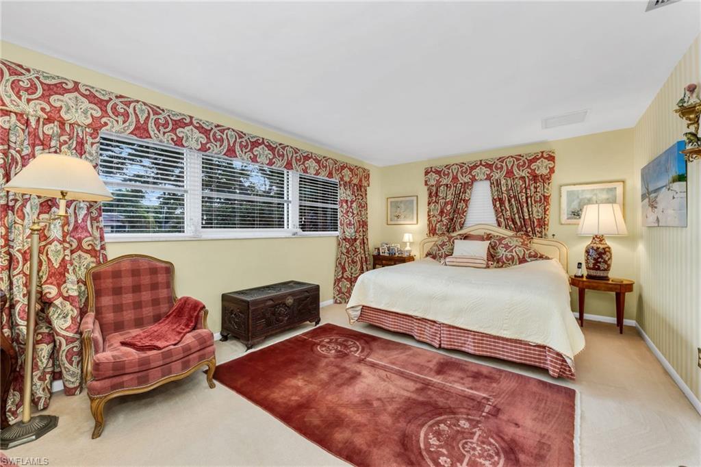 737 Anchor Rode Drive Naples, FL 34103 - Photo 10 of 21 Bedroom with carpet floors and multiple windows
