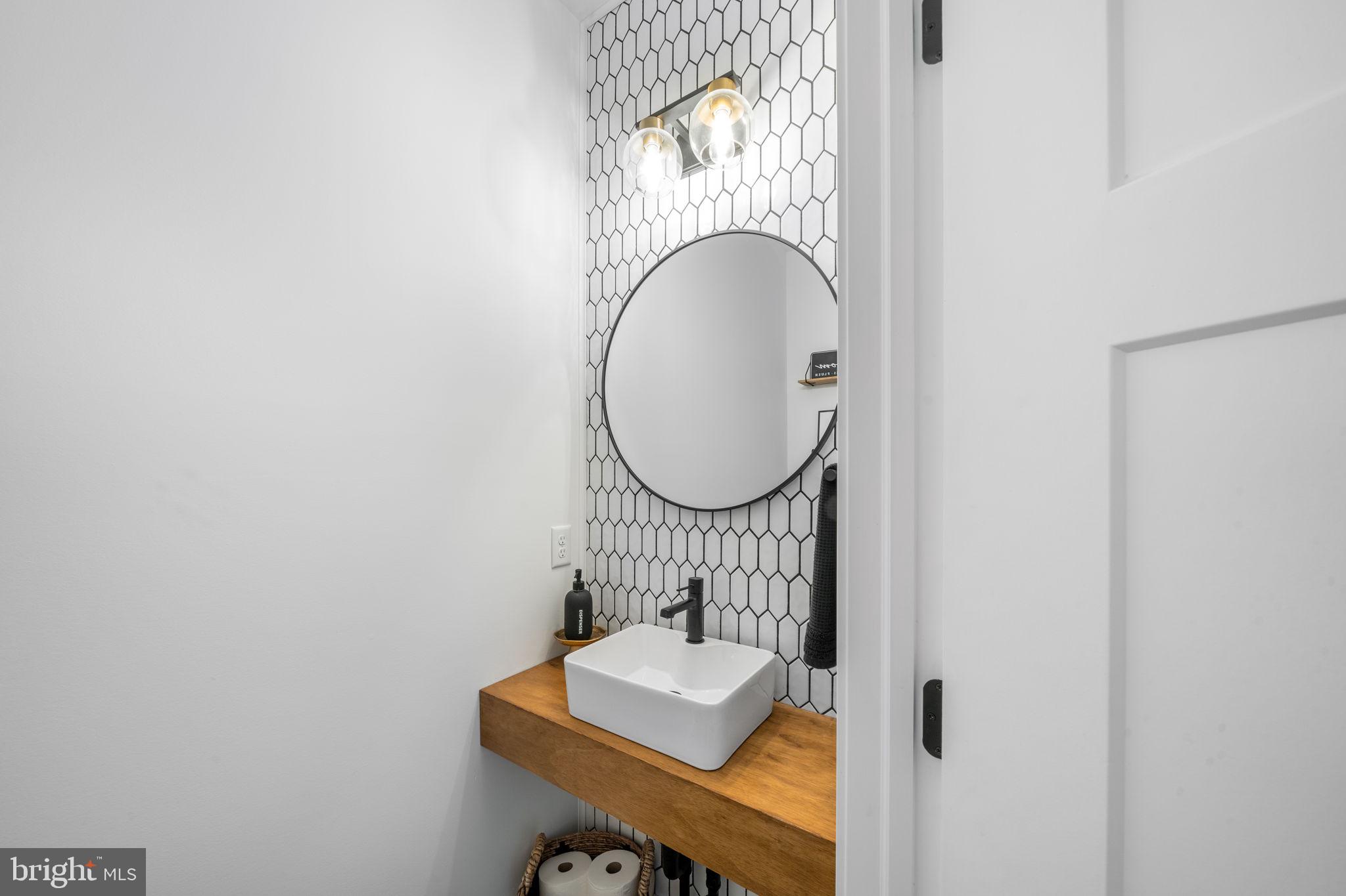 611 Grouse Road Exton, PA 19341 - Photo 11 of 59 a bathroom with a sink mirror and vanity