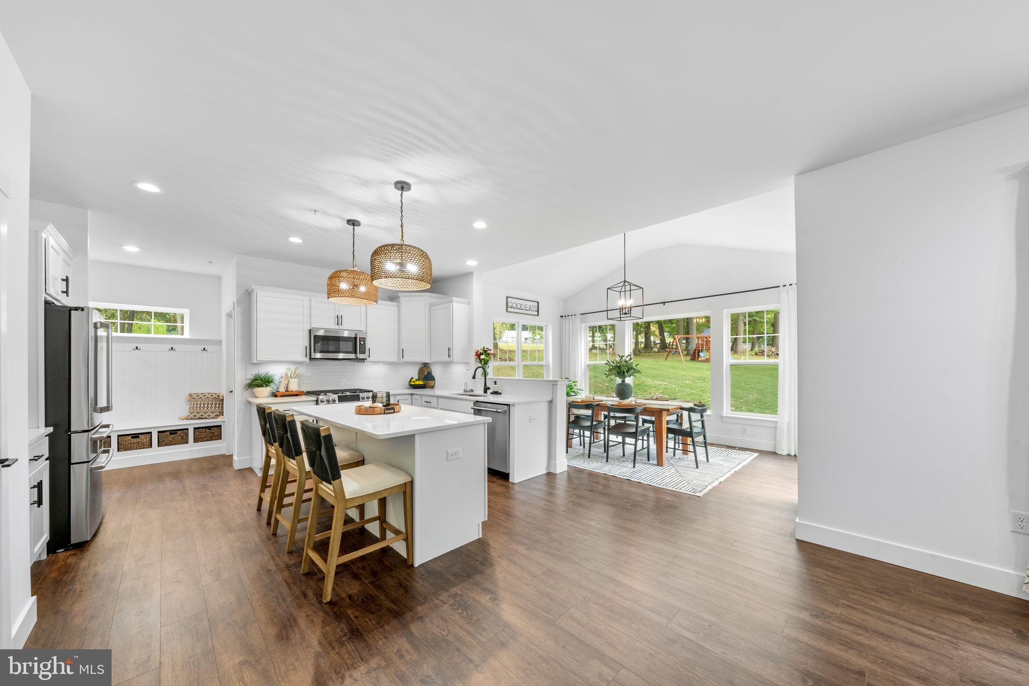 611 Grouse Road Exton, PA 19341 - Photo 12 of 59 a view of a dining room with furniture window and wooden floor