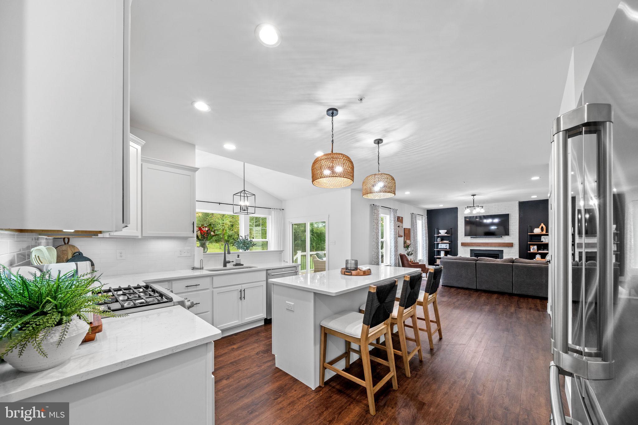 611 Grouse Road Exton, PA 19341 - Photo 14 of 59 a kitchen with a table and chairs in it