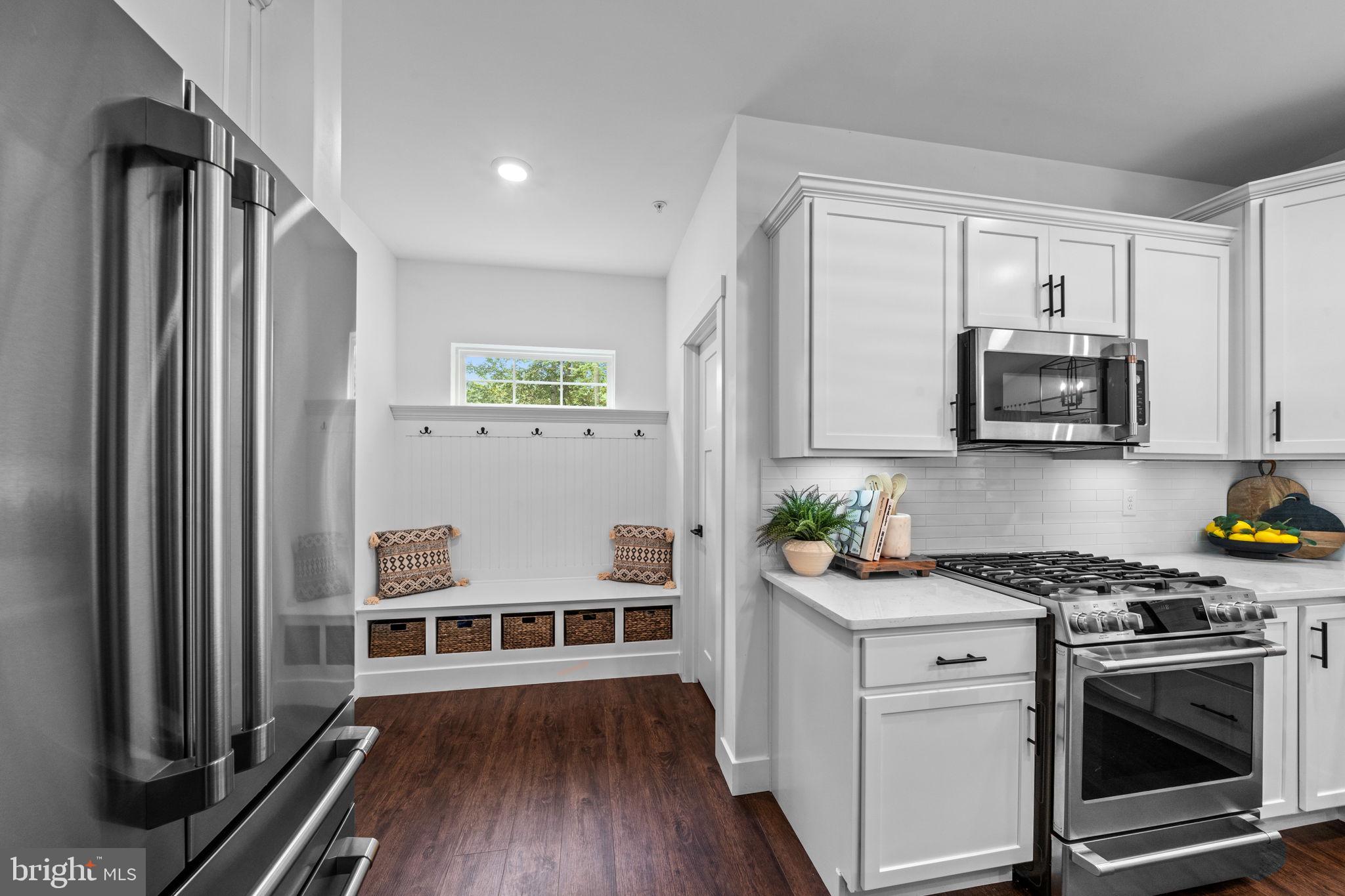 611 Grouse Road Exton, PA 19341 - Photo 15 of 59 a kitchen with stainless steel appliances a white stove top oven and a refrigerator