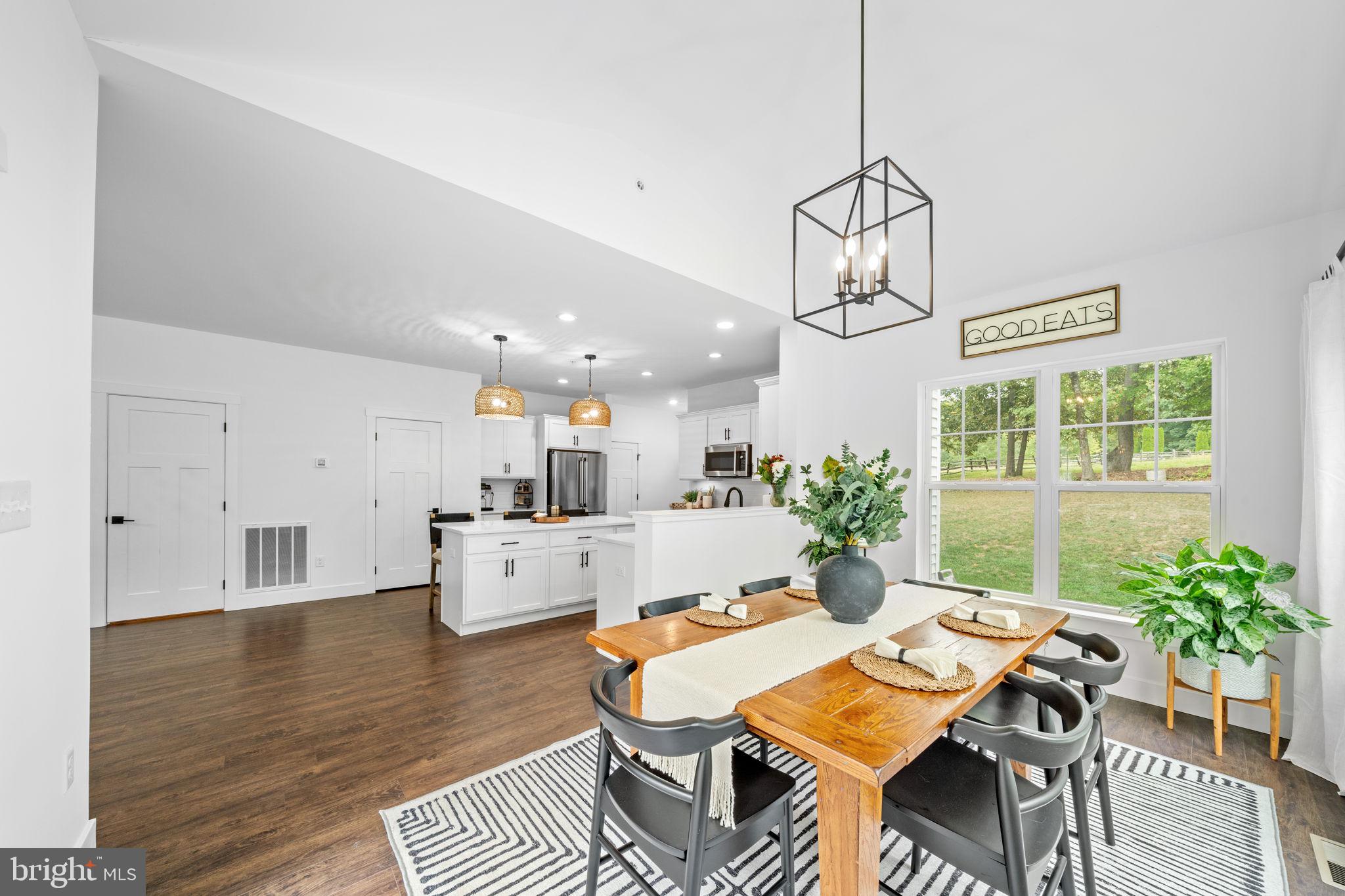 611 Grouse Road Exton, PA 19341 - Photo 17 of 59 a view of a dining room with furniture window and wooden floor