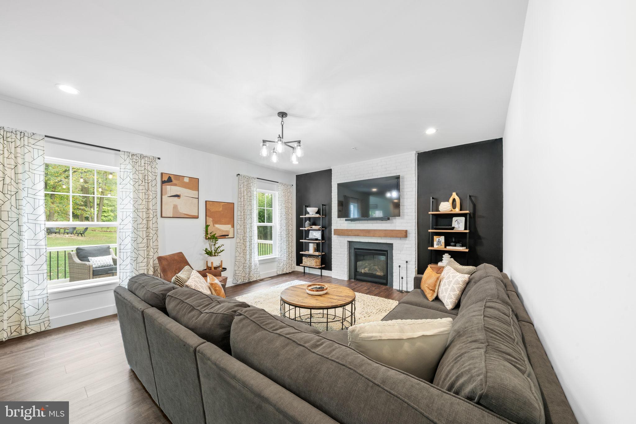 611 Grouse Road Exton, PA 19341 - Photo 20 of 59 a living room with furniture and a fireplace