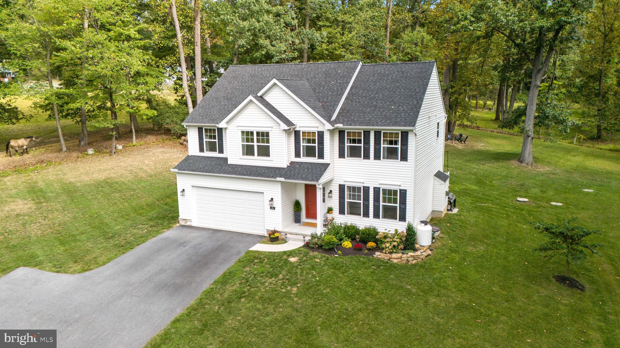 611 Grouse Road Exton, PA 19341 - Photo 2 of 59 a front view of a house with a yard