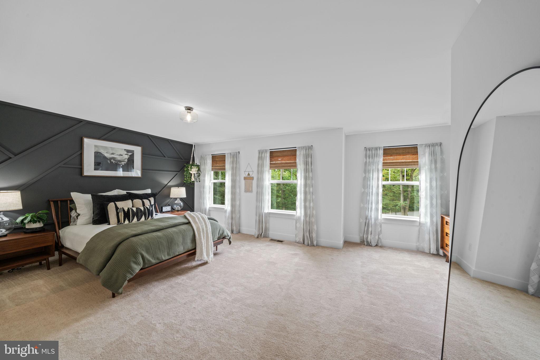 611 Grouse Road Exton, PA 19341 - Photo 27 of 59 a bed room with a bed and a couch