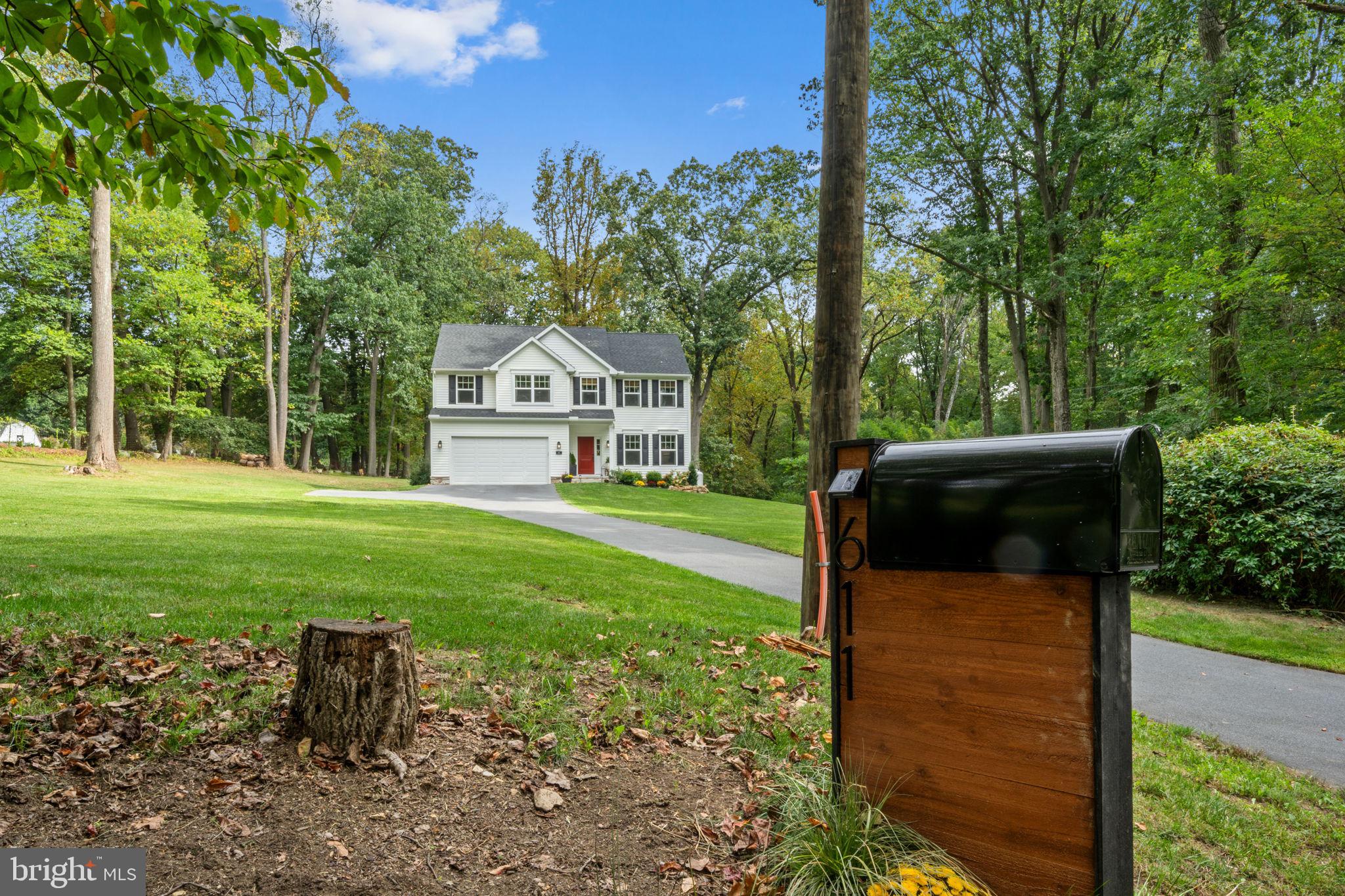 611 Grouse Road Exton, PA 19341 - Photo 3 of 59 a front view of a house with a yard