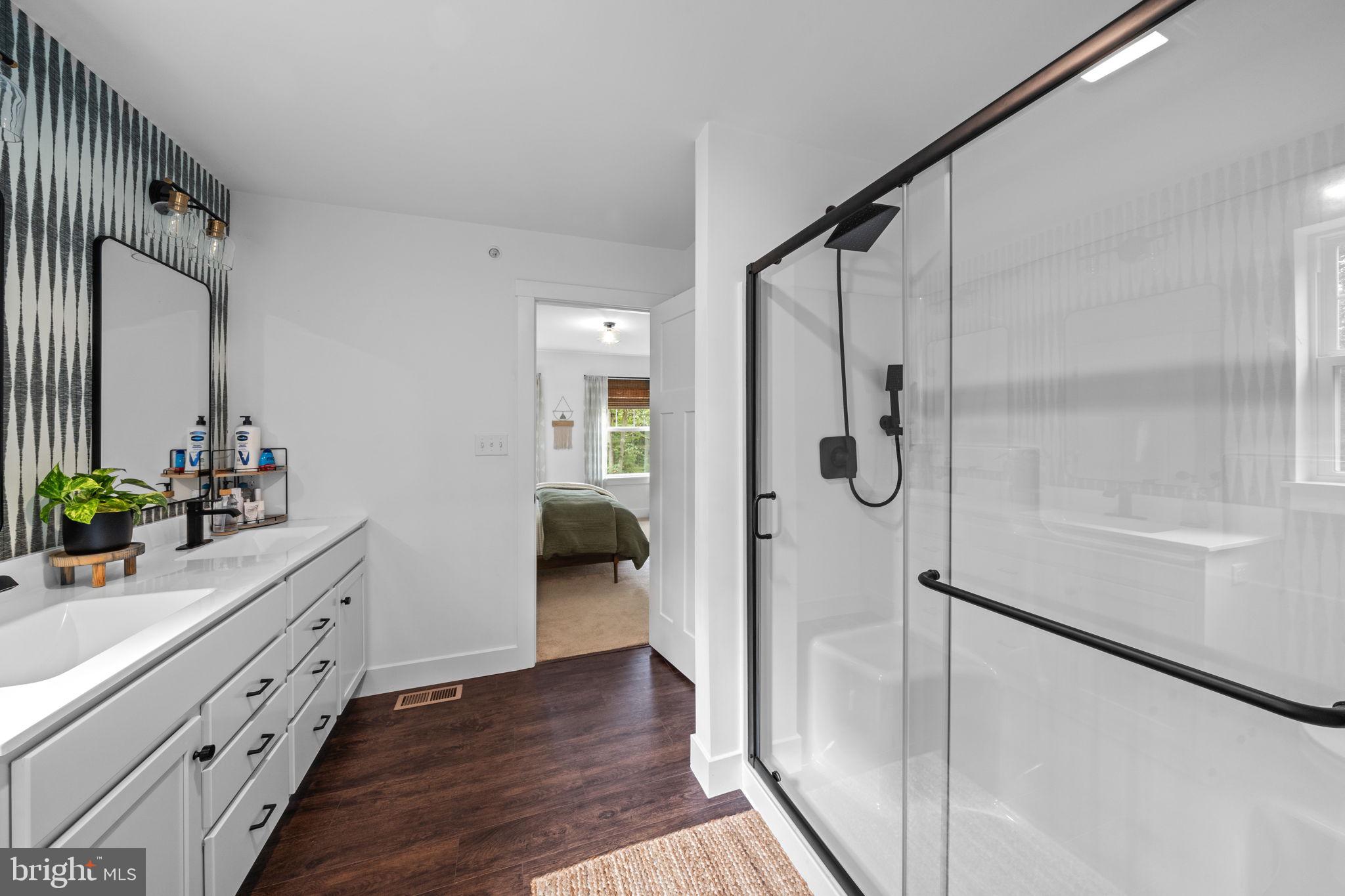 611 Grouse Road Exton, PA 19341 - Photo 32 of 59 a bathroom with a double vanity sink and shower