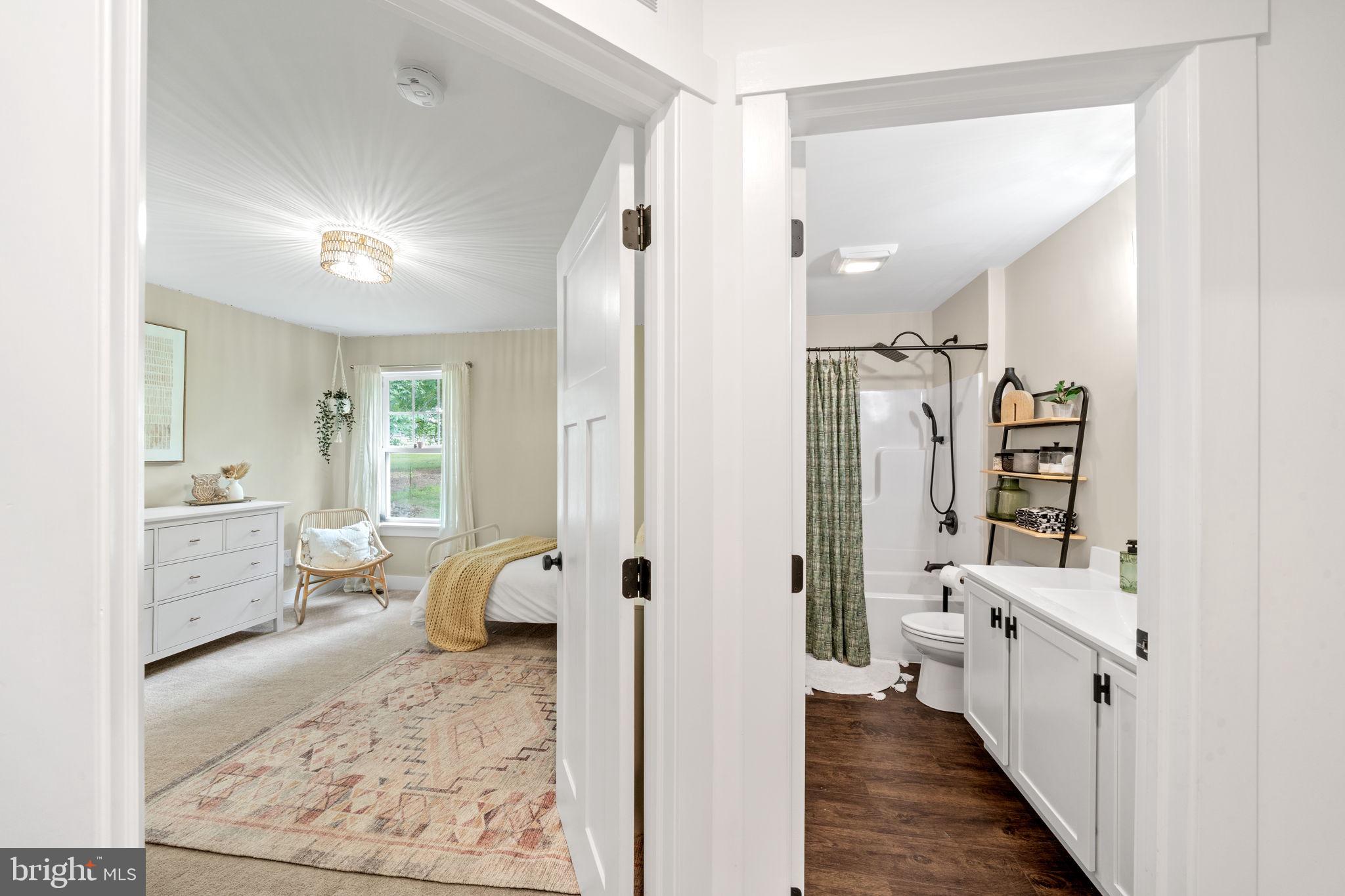 611 Grouse Road Exton, PA 19341 - Photo 34 of 59 a bathroom with a double vanity sink toilet and shower