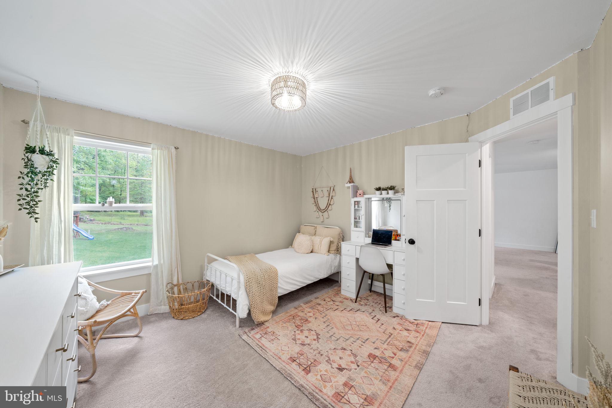 611 Grouse Road Exton, PA 19341 - Photo 35 of 59 a living room with furniture and a large window