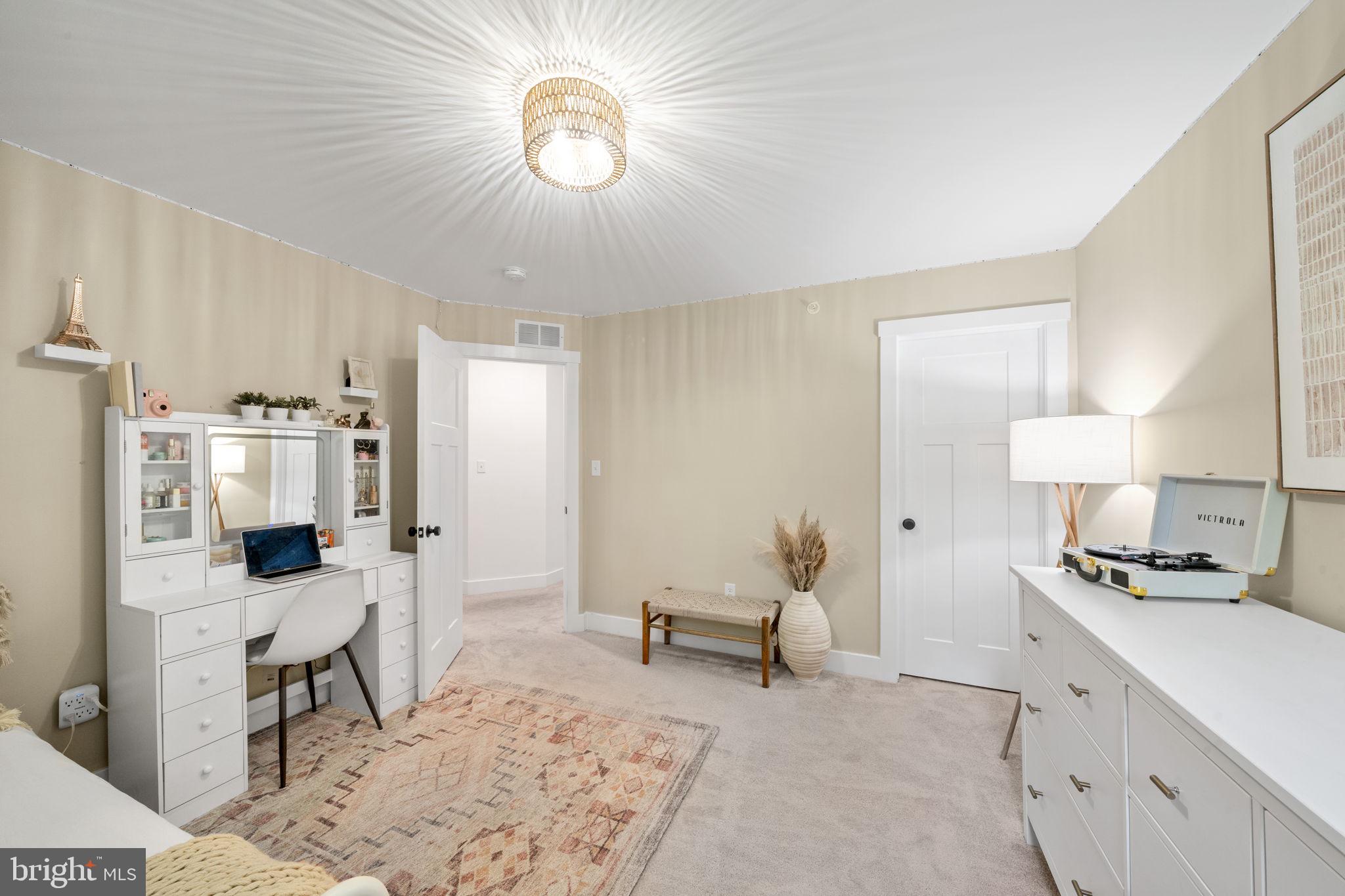 611 Grouse Road Exton, PA 19341 - Photo 36 of 59 a living room with furniture and a chandelier