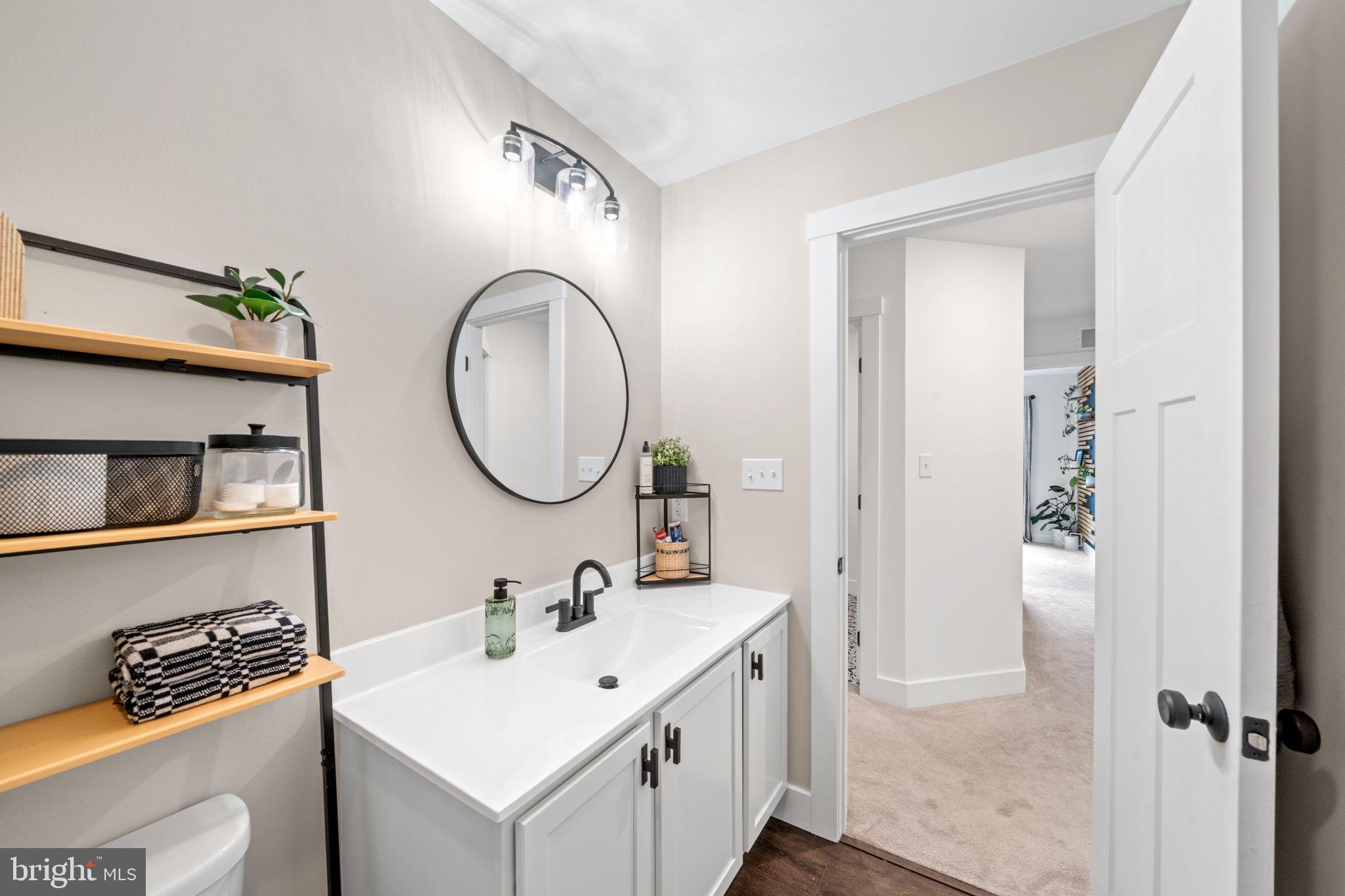 611 Grouse Road Exton, PA 19341 - Photo 39 of 59 a bathroom with a sink and a mirror