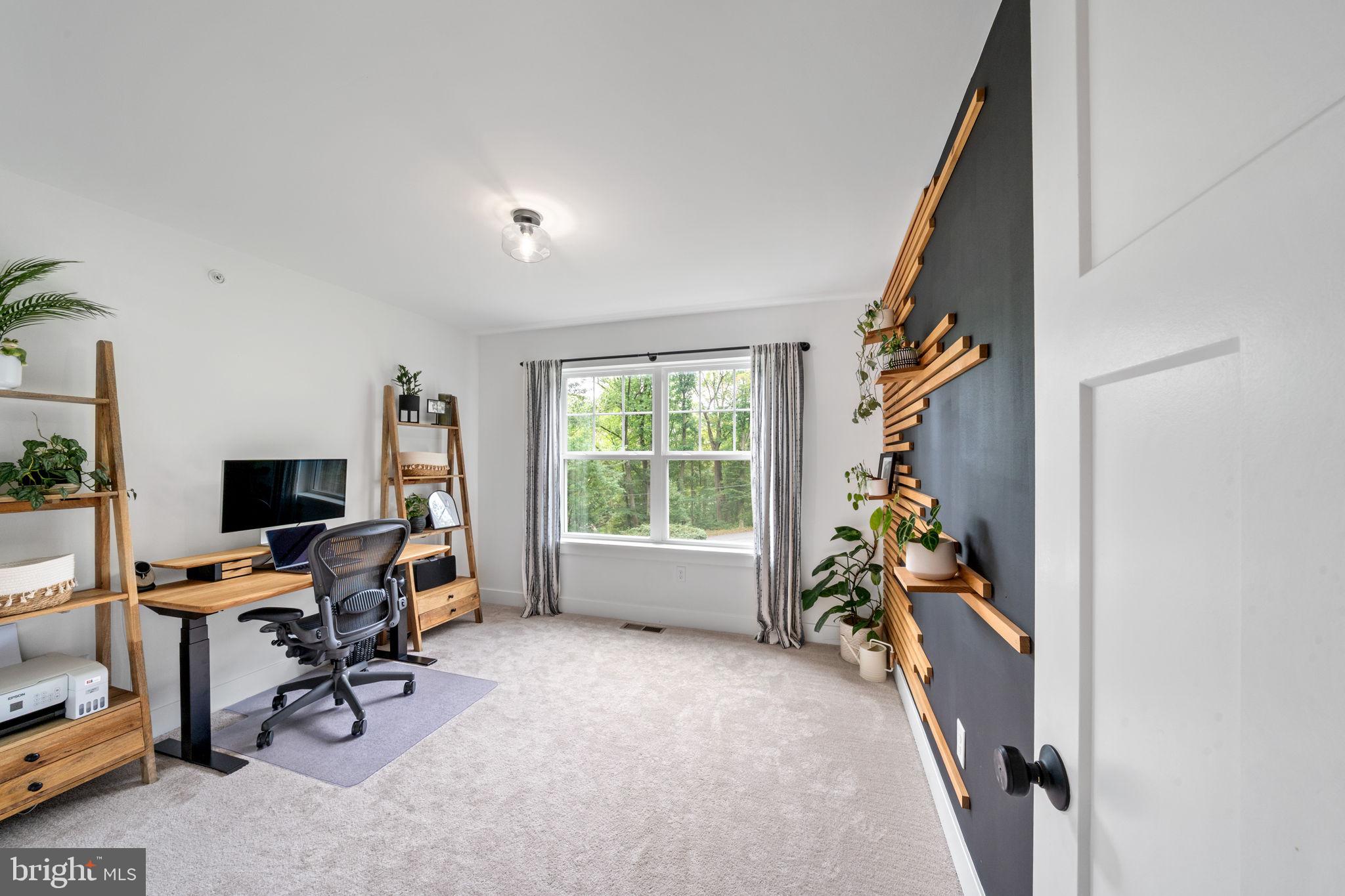 611 Grouse Road Exton, PA 19341 - Photo 41 of 59 a view of a workspace with furniture and a window
