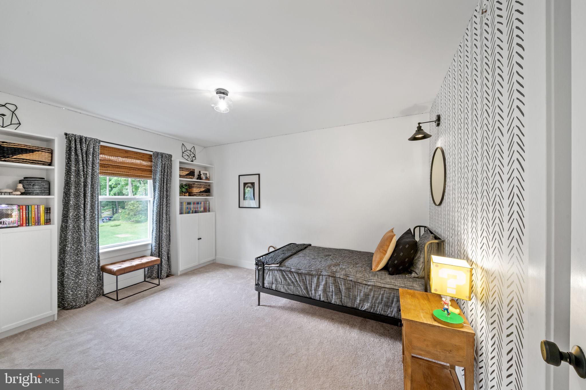 611 Grouse Road Exton, PA 19341 - Photo 43 of 59 a bedroom with furniture and a window