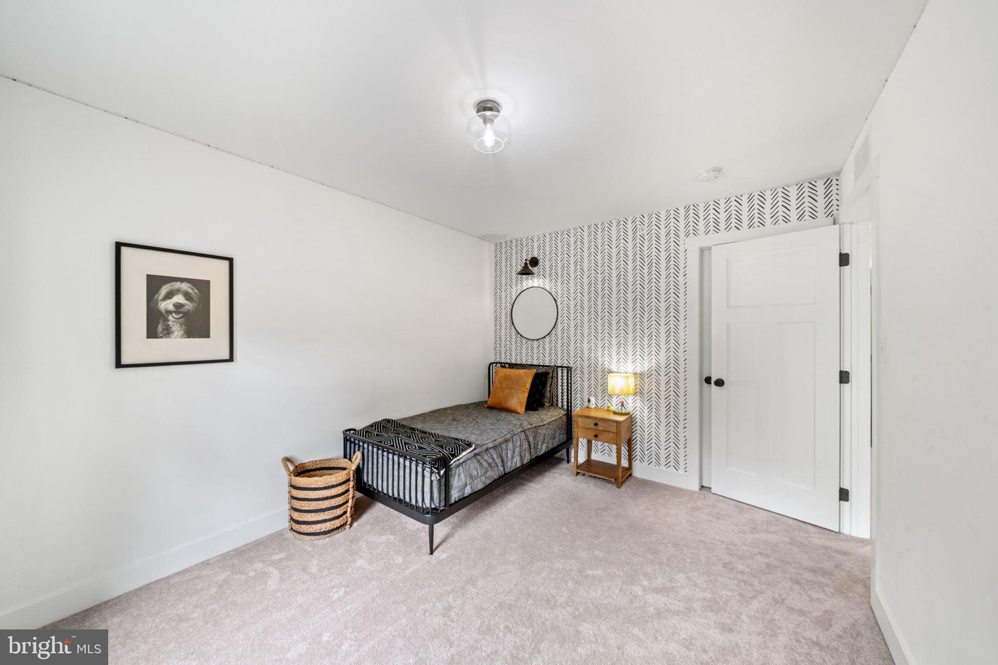 611 Grouse Road Exton, PA 19341 - Photo 44 of 59 a living room with furniture and a chandelier