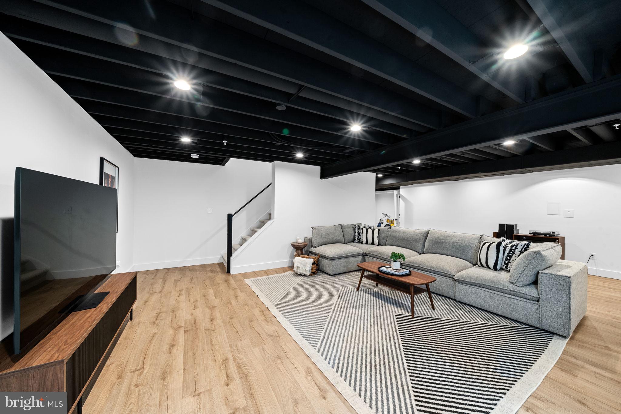 611 Grouse Road Exton, PA 19341 - Photo 47 of 59 a living room with furniture and a flat screen tv