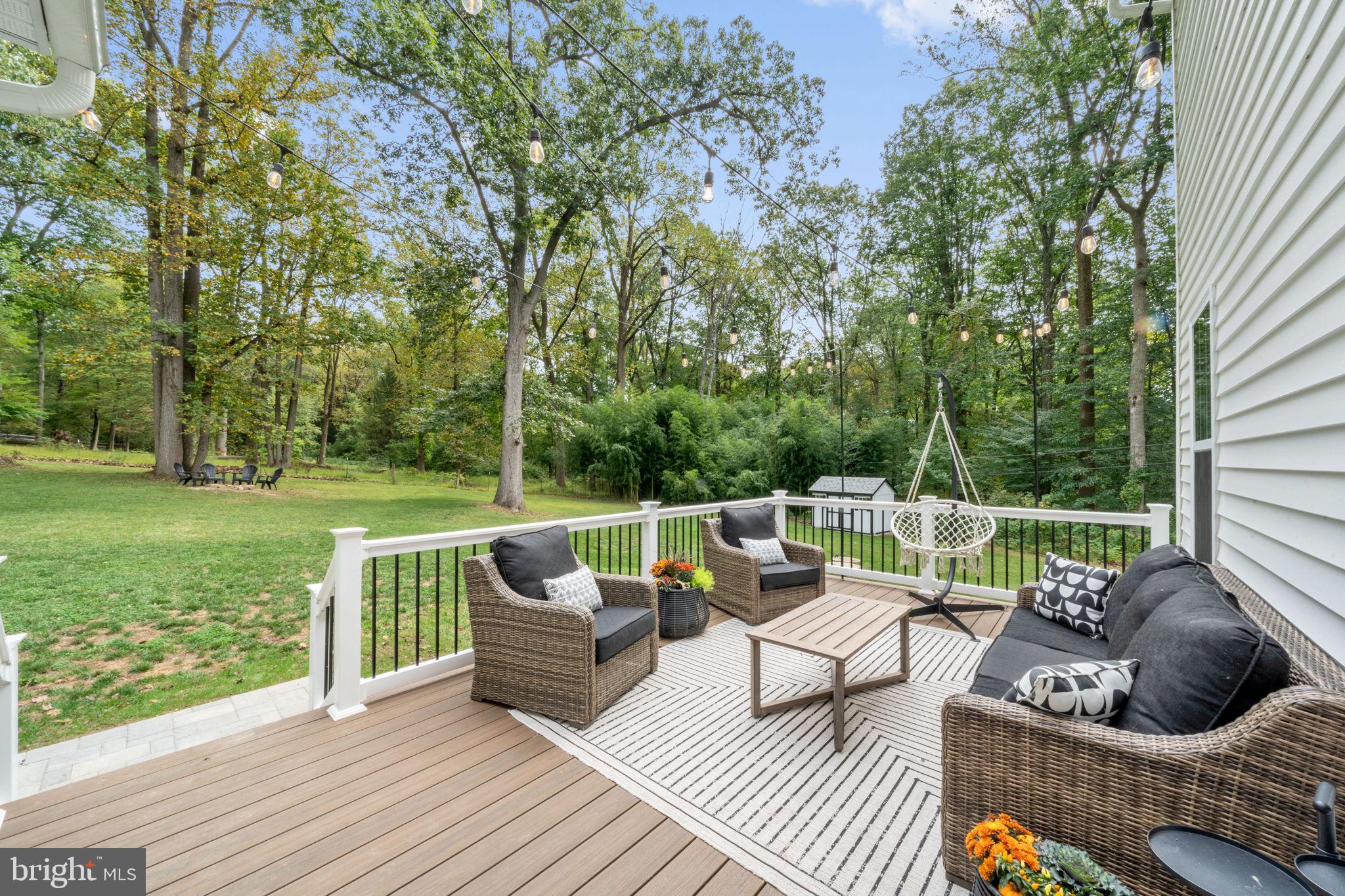 611 Grouse Road Exton, PA 19341 - Photo 50 of 59 a view of a patio with couches chairs and a yard