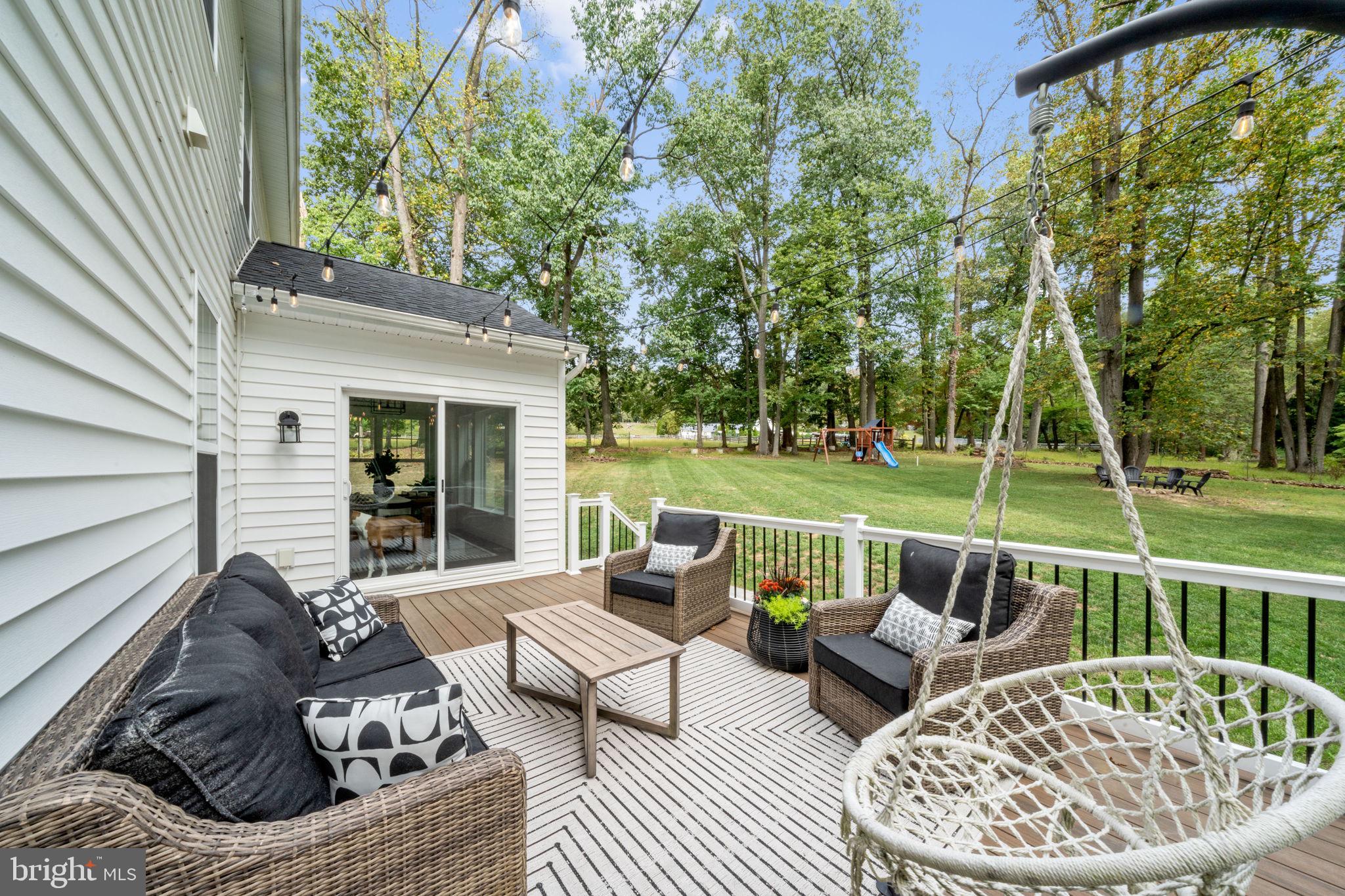 611 Grouse Road Exton, PA 19341 - Photo 51 of 59 a view of a patio with couches chairs and a table and chairs with garden view