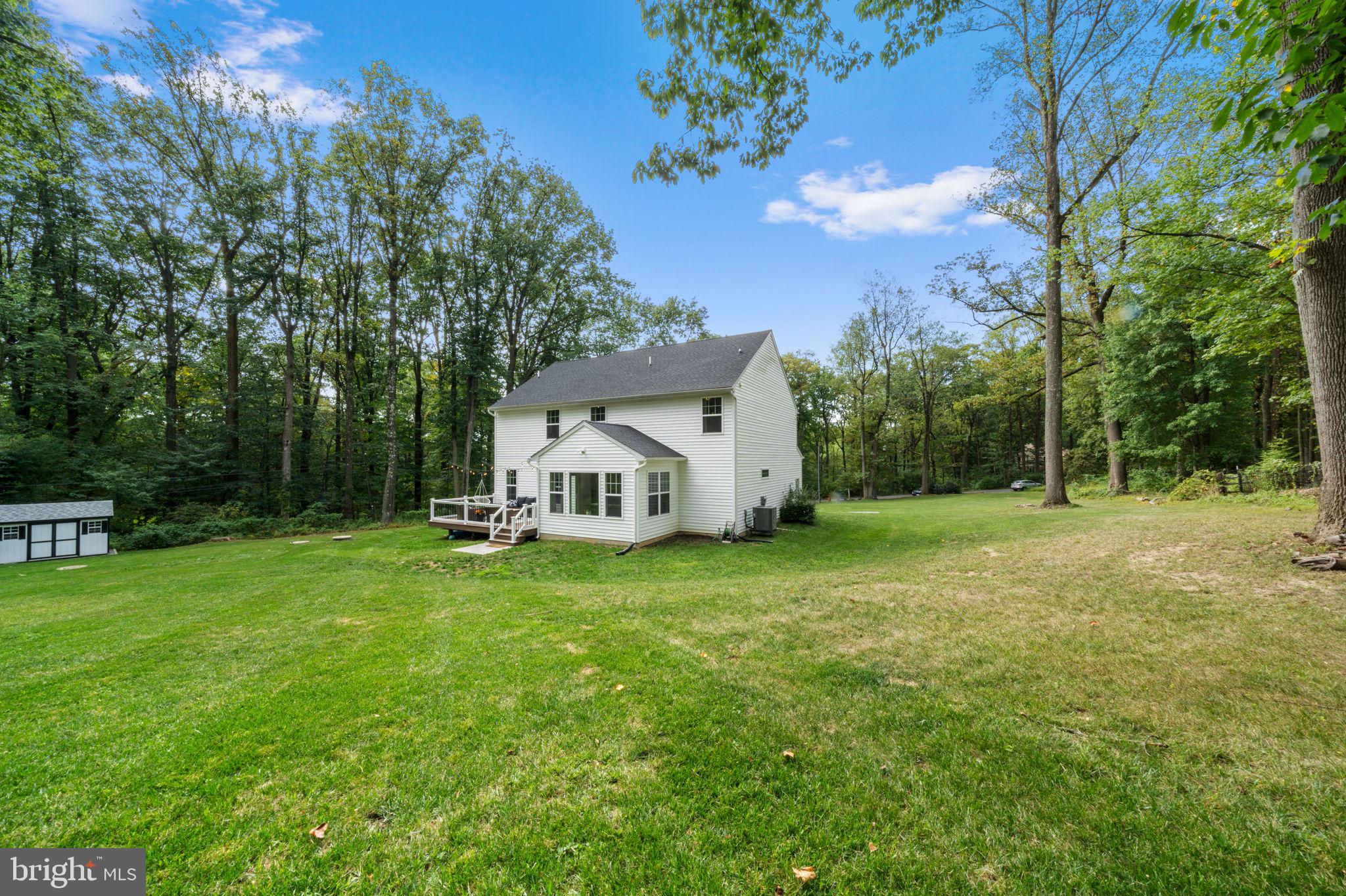 611 Grouse Road Exton, PA 19341 - Photo 53 of 59 a view of a house with backyard and garden