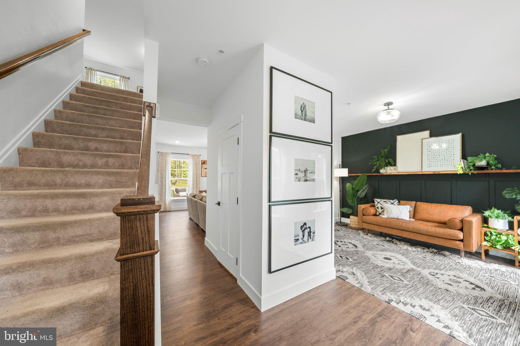 611 Grouse Road Exton, PA 19341 - Photo 6 of 59 a view of a hallway with wooden floor and furniture