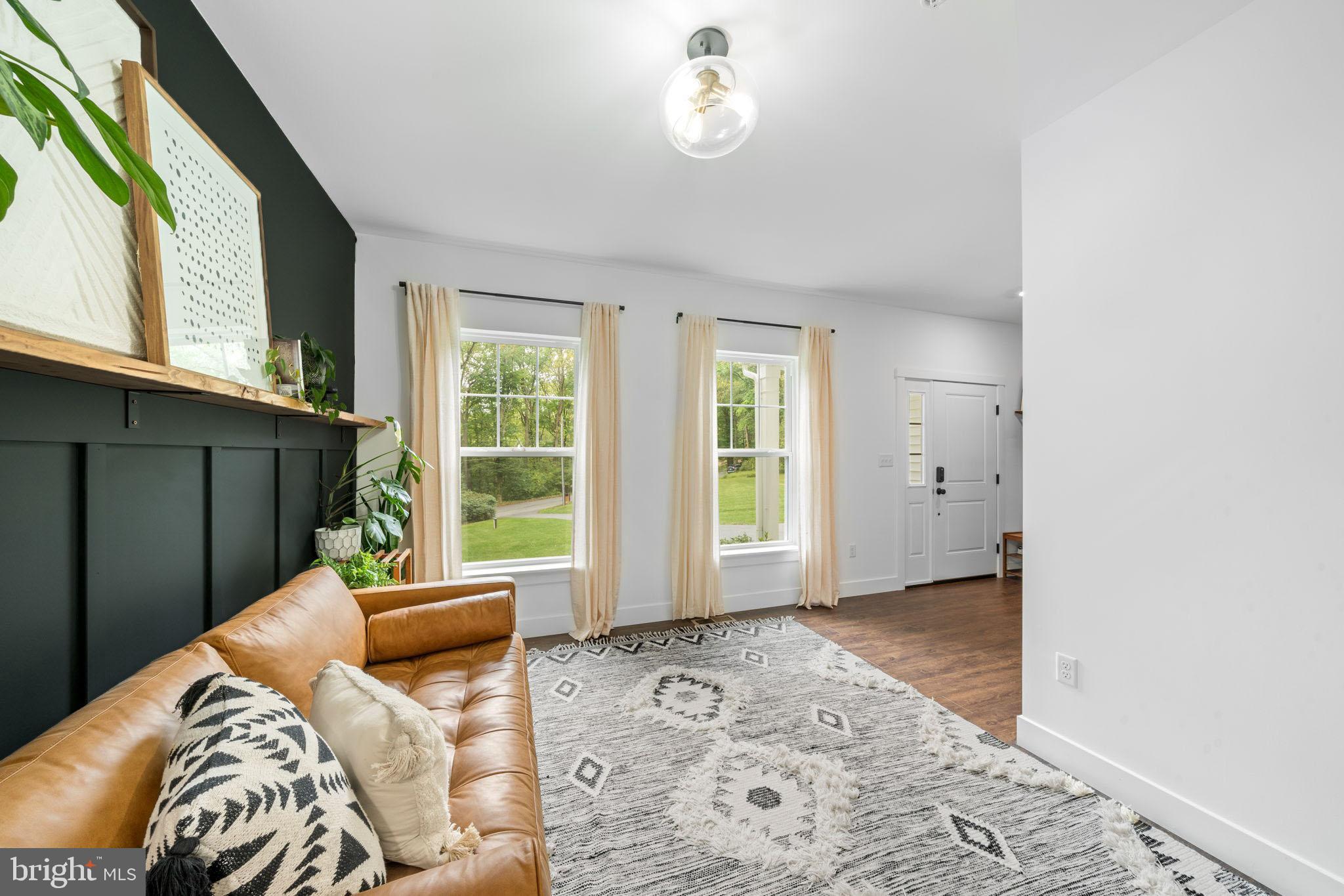 611 Grouse Road Exton, PA 19341 - Photo 8 of 59 a bedroom with furniture and a window