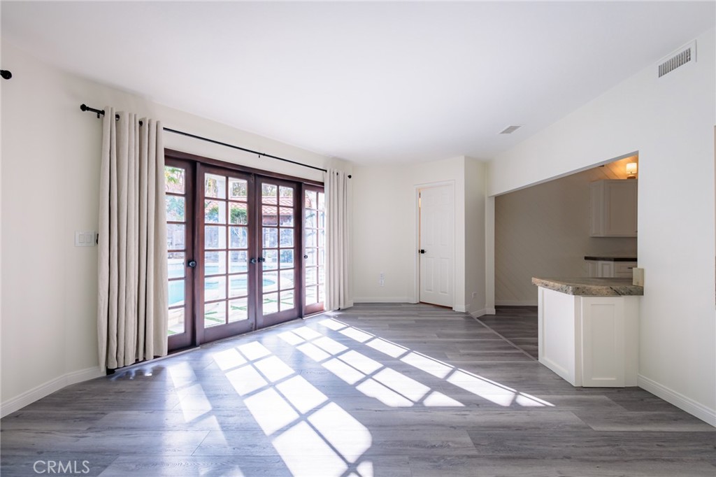 25342 Hugo Road Laguna Niguel, CA 92677 - Photo 15 of 36 Family Room with french doors looking out to the pool