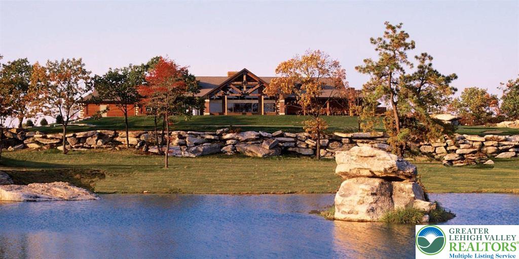 370 Inverness Lane Hazleton, PA 18202 - Photo 4 of 8 a view of a lake with a house